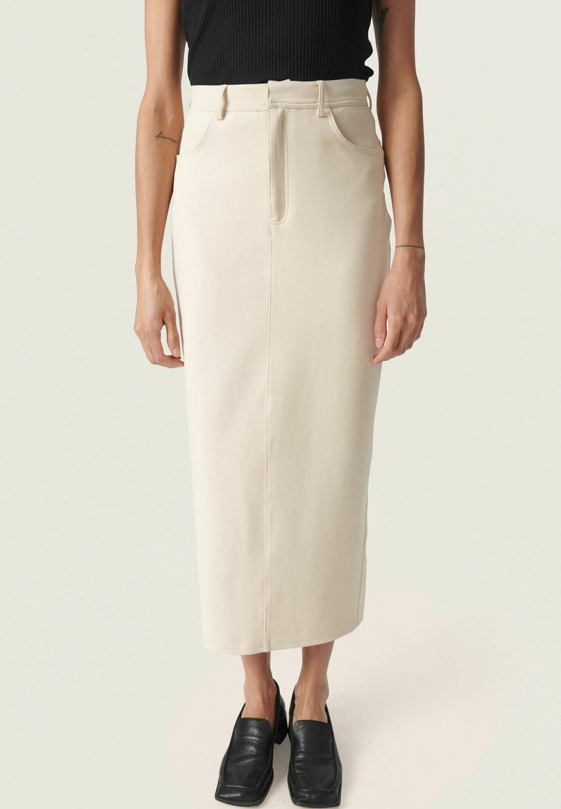 Beige midi-hame, jossa on korkea vyötärö, suora leikkaus ja kaksi etutaskua. Valmistettu teksturoidusta, kevyestä kankaasta.