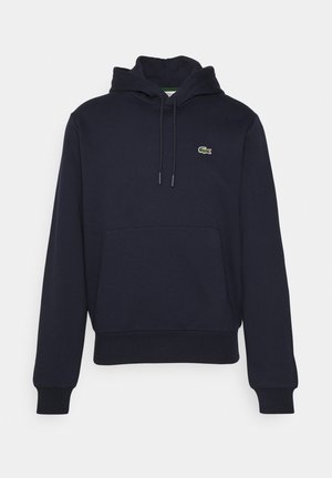 Marineblauwe hoodie met voorzak in kangoeroestijl, trekkoordkap, geribbelde manchetten en een klein groen krokodillenlogo op de borst.