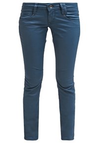 Blauwe slim-fit jeans van soepele stof met een klassieke knoopsluiting, voorzakken en verhoogde stiksels op de heupen.