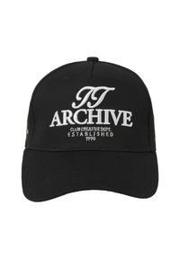 Black cotton cap with a curved brim, featuring white embroidered text: "TT ARCHIVE CLUB CREATIVE DEPT. ESTABLISHED 1990."