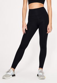 Röhnisch SHAPE HIGH WAIST - Leggings - black