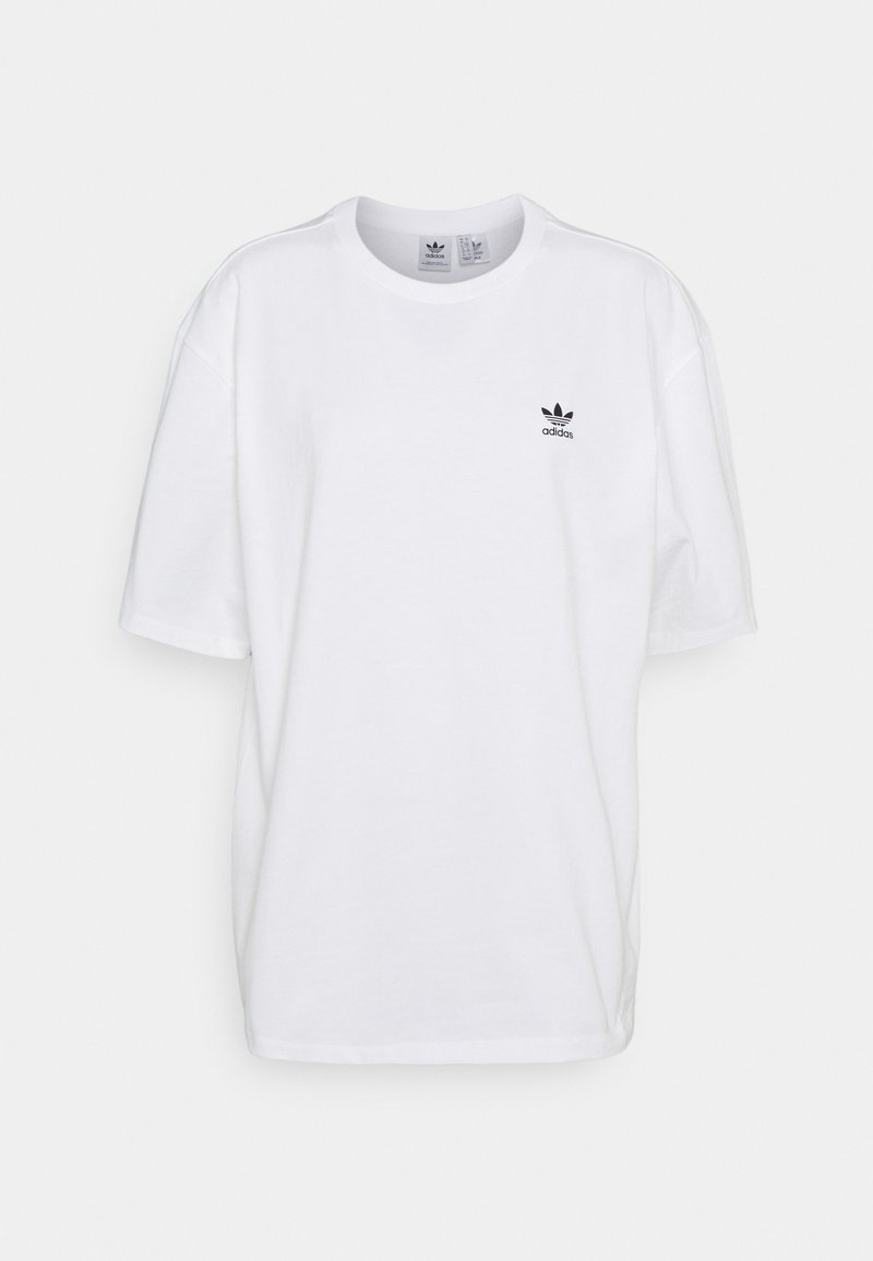 Biela bavlnená tričko s voľným strihom, s čiernym logom Adidas na ľavej hrudi. Krátke rukávy a okrúhly výstrih.