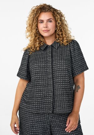 Black and white textured short-sleeve shirt with a collar, featuring a grid pattern and a straight cut, paired with matching shorts.