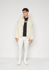 HUGO DOAK - Tracksuit bottoms - open white
