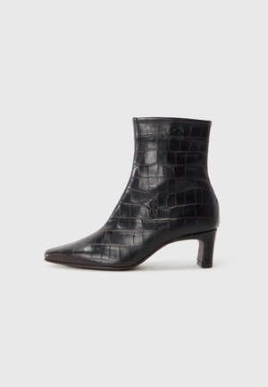 Black crocodile-embossed ankle boot featuring a pointed toe, medium heel, and smooth texture. Seamless design with minimal accents.
