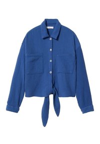 Sininen, teksturoitu lyhyt paita, jossa on kaulus, napitettu etuosa ja kaksi rintataskua. Edessä solmittava yksityiskohta ja käärityt hihat.