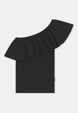 Haut noir asymétrique avec une large volants traversant la poitrine et l'épaule, fabriqué en tissu lisse et extensible.