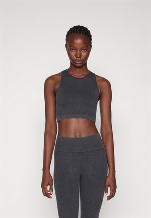 Gray ribbed athletic crop top and matching high-waisted leggings, featuring a seamless design and textured fabric for comfort.