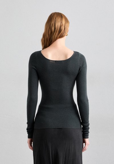 Dark gray long-sleeve fitted top with a wide scoop neck, made of ribbed knit fabric, accentuating a smooth texture and tailored shape.