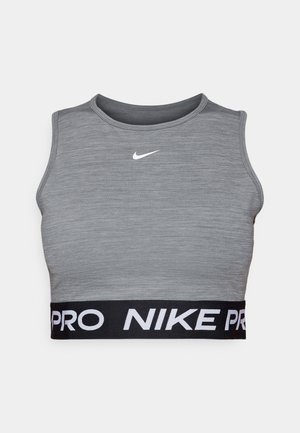 Gray athletic crop top made of smooth fabric, featuring a rounded neckline and a black elastic band with white "NIKE PRO" lettering.