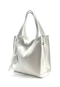 White leather tote bag with a soft texture, oval shape, and side tassel. Features a small Italian flag charm attached to the zipper.