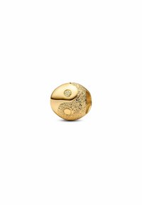 Goldfarbener Perle mit einem Yin-Yang-Design. Eine Hälfte hat eine glatte Oberfläche, die andere ist strukturiert mit einem funkenden Detail und zwei runden Akzenten.