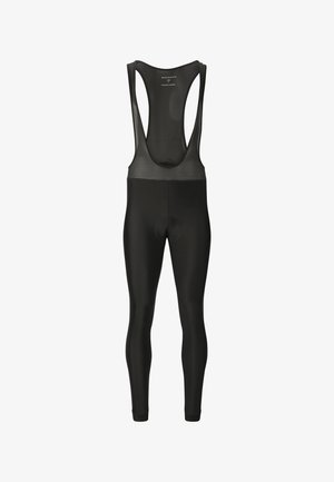 Zwarte fietspetjes met bovenste bandjes van mesh en een gewatteerd zitvlak, ontworpen voor prestaties en comfort.