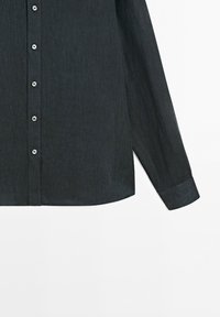 Dark gray long-sleeve button-up shirt with visible silver buttons on a plain white background.