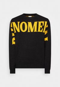 Pull noir avec un texte jaune audacieux. Le modèle présente un col rond et des poignets et un ourlet côtelés. Confectionné dans un tissu doux et texturé.