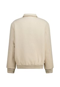 Beige fleece jacket with a relaxed fit, wide sleeves, and a ribbed hem. Features a collared neck and smooth texture without embellishments.