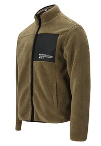 Fleecejakke i olivengrøn med en sort brystlomme. Har høj krave, fuld lynlås og struktureret stof. Brandlogoet vises.