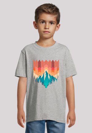 Gray cotton t-shirt featuring a colorful mountain and forest graphic in shades of teal, orange, and pink. Loose fit with short sleeves.