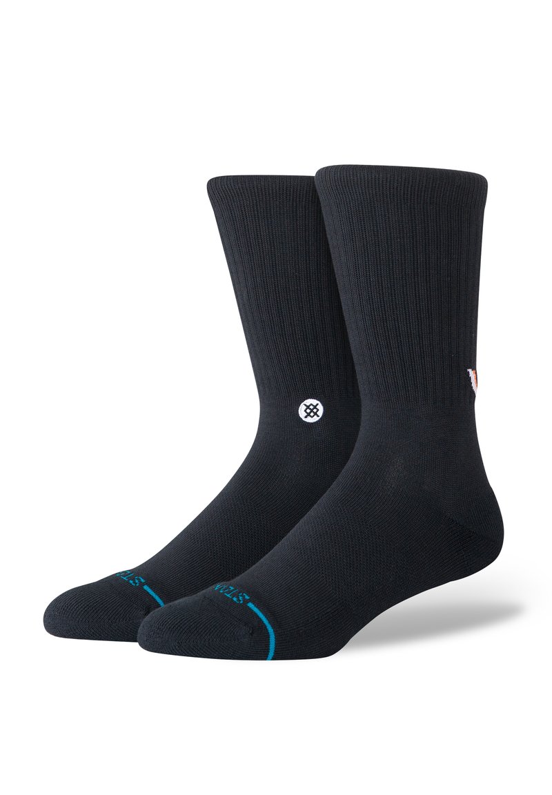 Black knee-high socks with ribbed texture, featuring a white logo on the side and a turquoise accent at the toe. Soft material.