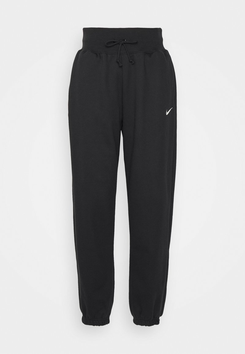 Schwarze Jogginghosen aus weichem Baumwollmix, mit elastischem Bund und Kordelzug sowie elastischen Bündchen. Nike-Logo am linken Oberschenkel.
