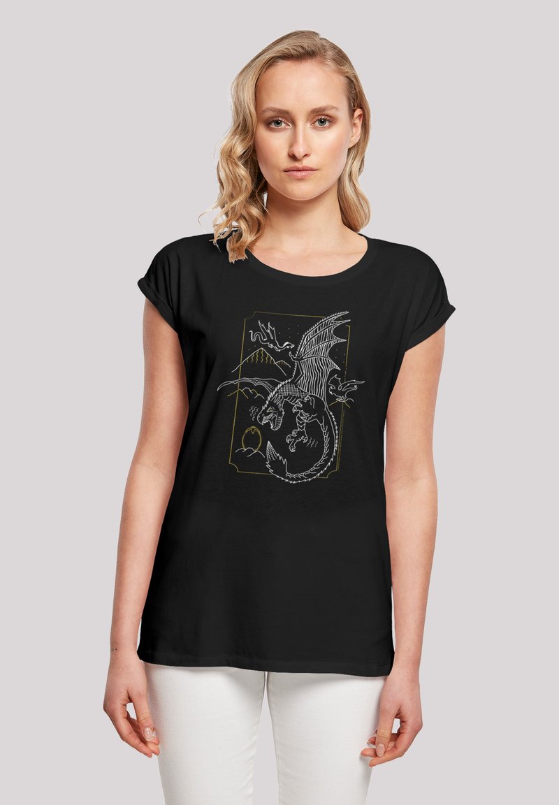 Black short-sleeve t-shirt featuring a dragon graphic in white and gold, with mountain and egg details. Smooth fabric, relaxed fit.