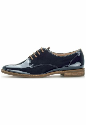 Navy blue patent leather dress shoe with a rounded toe, six eyelets, beige laces, and a brown textured sole.