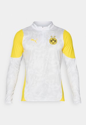 Camisa desportiva branca de mangas longas com mangas amarelas, gola com meio fecho, logótipo da Puma e emblema do Borussia Dortmund BVB 09 no peito.