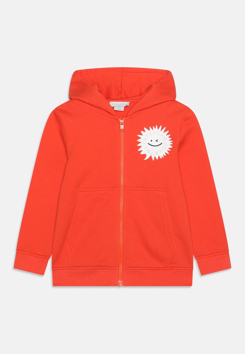 Sweat à capuche zippé orange vif pour enfants, avec capuche, poches avant et motif de soleil blanc avec sourire et texte sur le côté gauche de la poitrine.