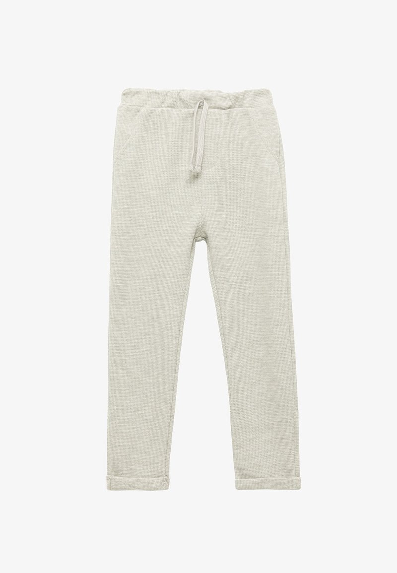 Pantalon de survêtement en coton gris clair avec une finition texturée, taille élastique, cordon de serrage et deux poches latérales, présentant un design de jambe fuselée.