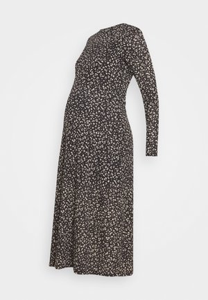 Sukienka ciążowa w kolorze czarnym z beżowym kwiatowym wzorem, wykonana z miękkiego materiału, z długim rękawem i dopasowanym krojem, który pomieści rosnący brzuszek.