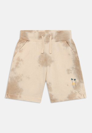 Shorts tie-dye beiges en tissu doux, avec une taille élastique, deux poches et un graphique de palmier en bas à gauche.
