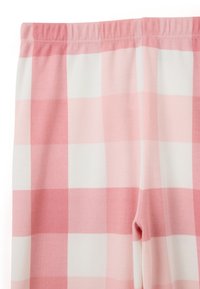 Schlafanzughosen im pink-weißen Karomuster, aus weichem Stoff mit einem elastischen Bund und glatter Textur.