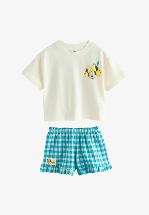 Top corto de manga corta color crema con gráfico de Minnie Mouse y limón, combinado con pantalones cortos con volantes de cuadros azules y blancos con parche de Minnie.