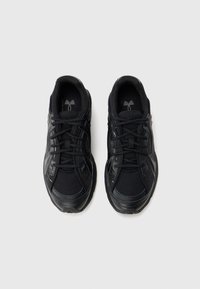 Pair of black athletic sneakers with mesh fabric and laces, viewed from above on a white background.