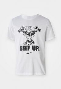 White cotton t-shirt featuring a cartoon burger lifting dumbbells with the text "BEEF UP." in bold black and a Nike logo below.