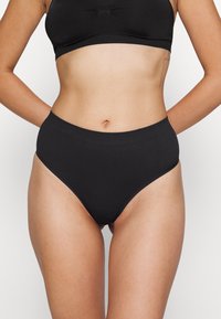 High-waisted black cotton briefs with a smooth texture, elastic waistband, and no visible seams for a clean finish.