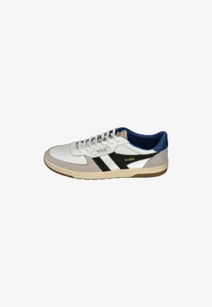 White and gray low-top sneaker with black stripes, blue collar, beige sole, and gold "Gola" branding on side and lace flap.