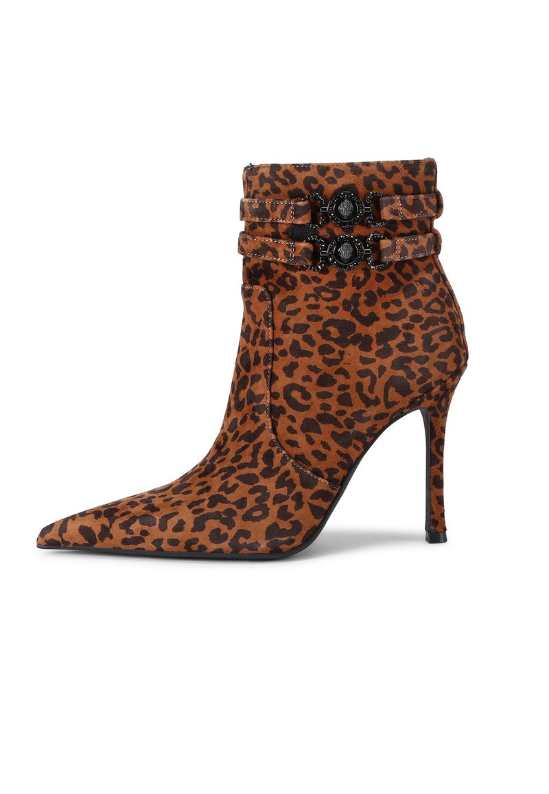 Leopard-print ankle boot made of suede, featuring a pointed toe, stiletto heel, and two decorative black straps with embellishments.