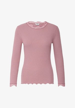 Roosa soonikkoes pikkade varrukatega pluus pitsilise äärisega ümarsel kaelusel ja varrukaservadel ning laineline alläär.