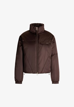 Brown puffer jacket with high collar, front zip, and elastic cuffs. Features horizontal seams and a chest pocket with logo detail.