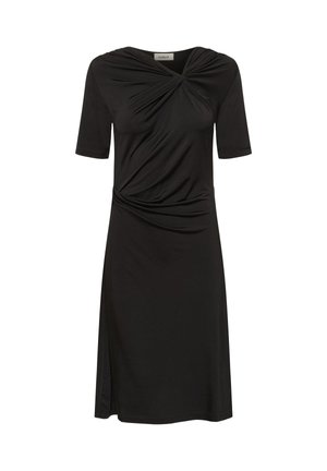 Černé šaty ke kolenům s krátkými rukávy, zkroucený uzlík na výstřihu a v pase a postranní rozparek na levé straně.