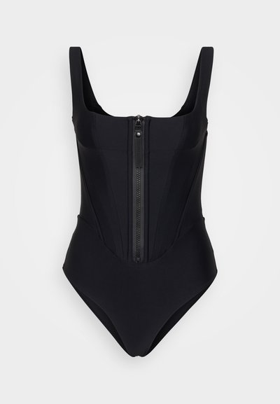 Černé jednodílné plavky se širokými ramínky, předním zipem a strukturálním panelem. Vyrobené z hladké, pružné látky.