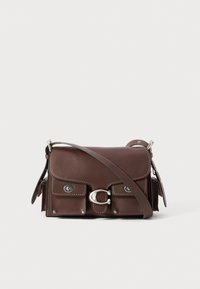 Brown leather crossbody bag with flap closure, silver hardware, double pocket accents, and adjustable strap. Smooth texture with stitching details.