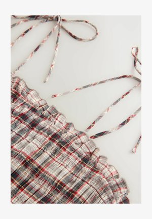 Auduma kreklu ar pelēku, sarkanu un melnu raibumu. Tamborētas malas un plānas regulējamas siksnas. Mīksta tekstūra.