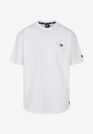 T-shirt en coton blanc à manches courtes, col rond et petit logo noir sur la poitrine. Design simple avec une coupe standard.