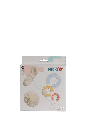 Craft kit with white yarn, three colorful wooden pom-pom makers in blue, yellow, red, and a completed white yarn pom-pom.