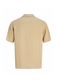 Chemise beige à manches courtes texturée avec un col classique, vue de dos sur fond blanc.