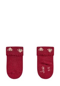 Rote Baumwollsocken mit einem strukturierten Bündchen, das cremefarbene Blättermuster zeigt. Glatte Oberfläche und abgerundete Zehen, geeignet für Freizeitbekleidung.