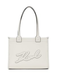 Balta ādas toša soma ar melniem akcentiem, ar iespiestu "Karl" logo, divām rokturiem un strukturētu taisnstūra formu. Ar teksturētu apdari.