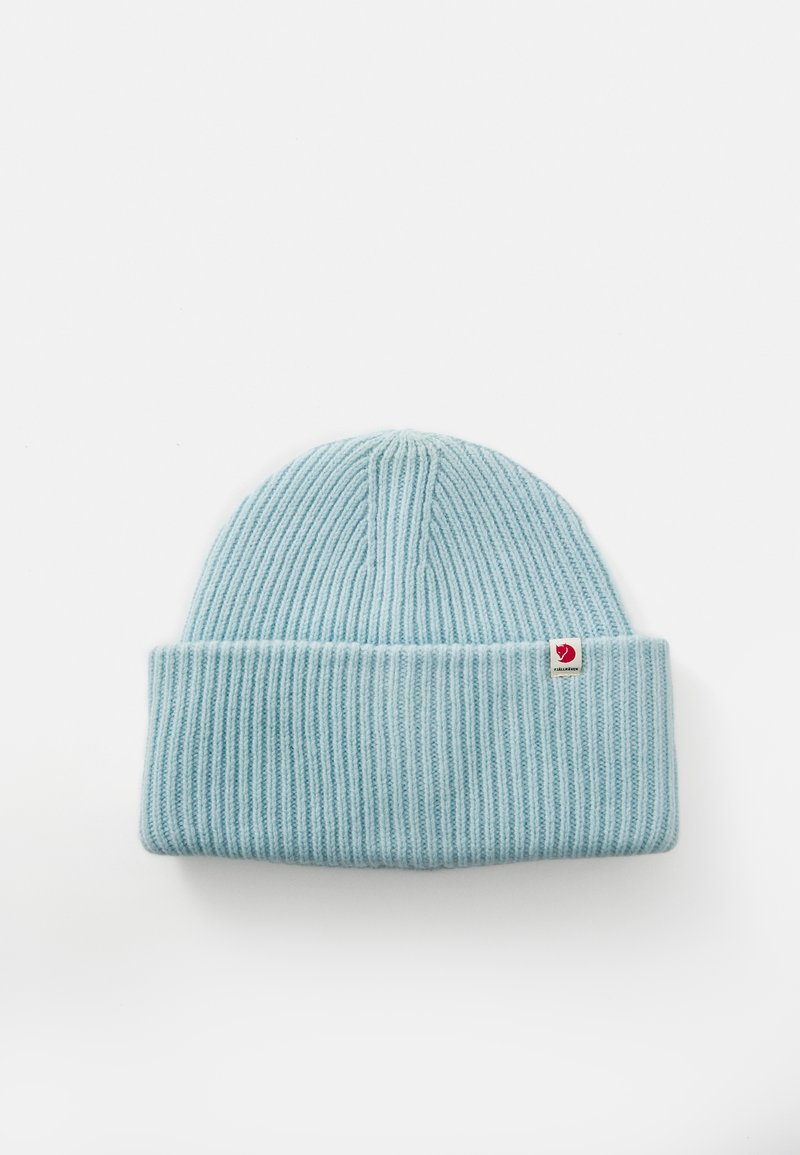 Light blue ribbed knit beanie with folded cuff and small red and white Fjällräven logo tag on a white background.